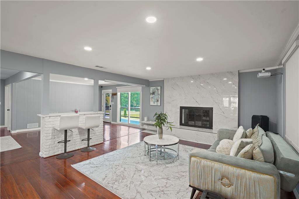 4166 Idlevale Drive Tucker, GA 30084 - Photo 15 of 36 a living room with furniture and a fireplace