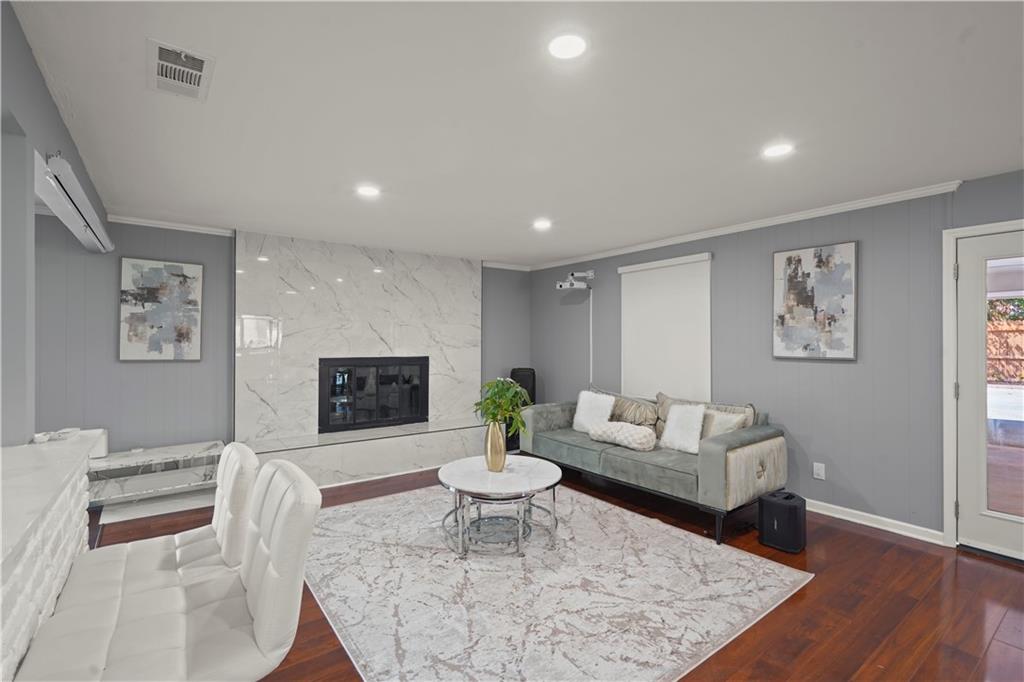 4166 Idlevale Drive Tucker, GA 30084 - Photo 16 of 36 a living room with furniture and a wooden floor