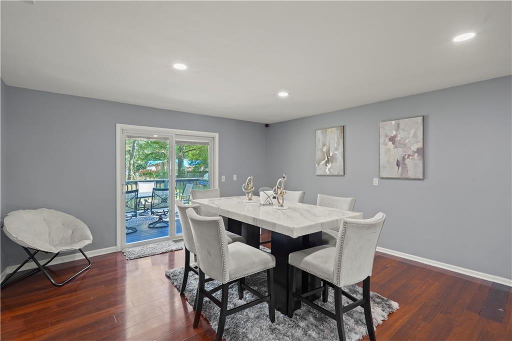 4166 Idlevale Drive Tucker, GA 30084 - Photo 21 of 36 a view of a dining room with furniture window and wooden floor