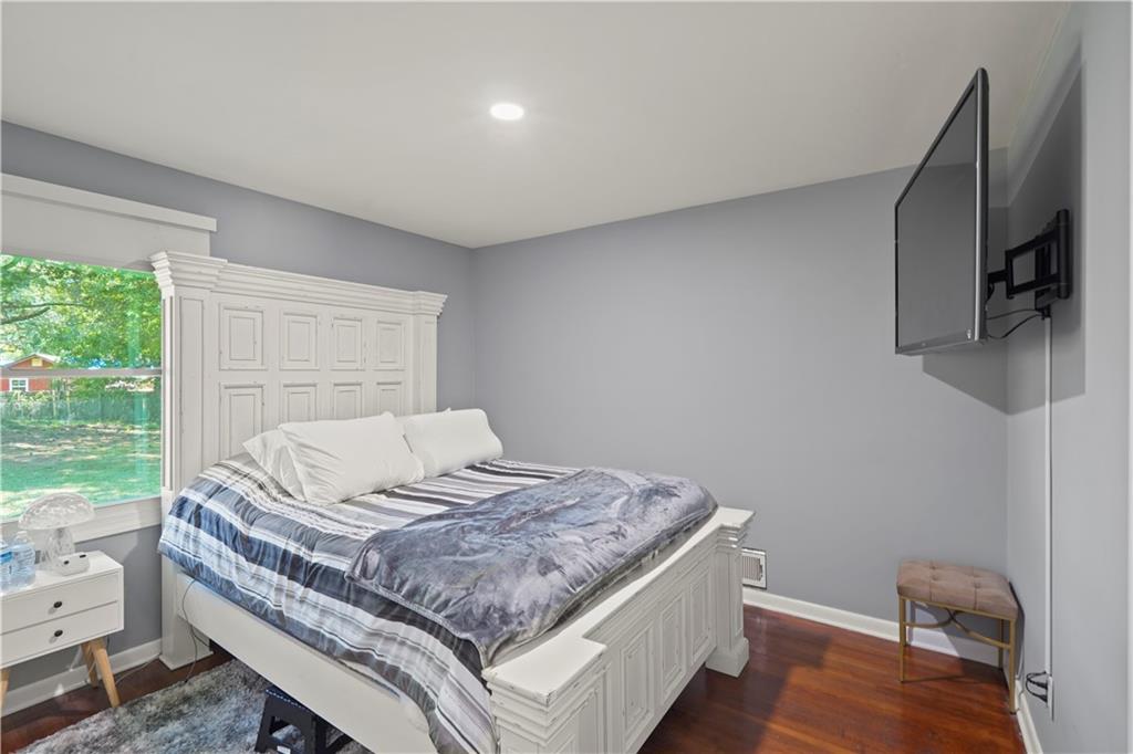 4166 Idlevale Drive Tucker, GA 30084 - Photo 36 of 36 a bed sitting in a bedroom next to a window