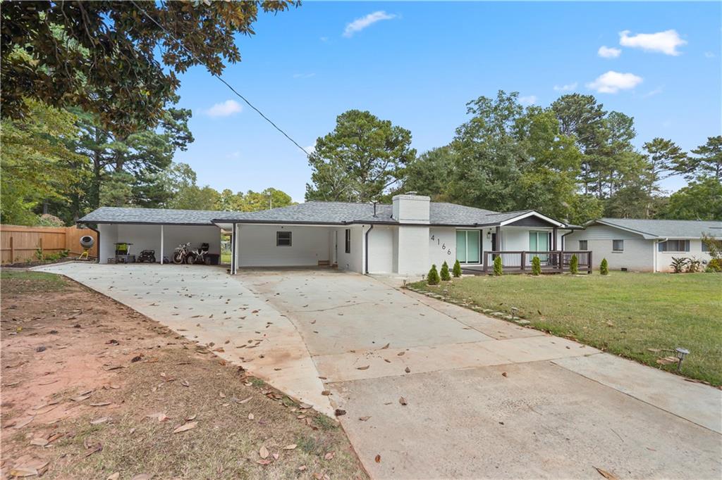 4166 Idlevale Drive Tucker, GA 30084 - Photo 8 of 36 a front view of a house with a yard and a garage