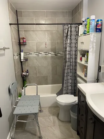 a bathroom with a sink toilet and shower