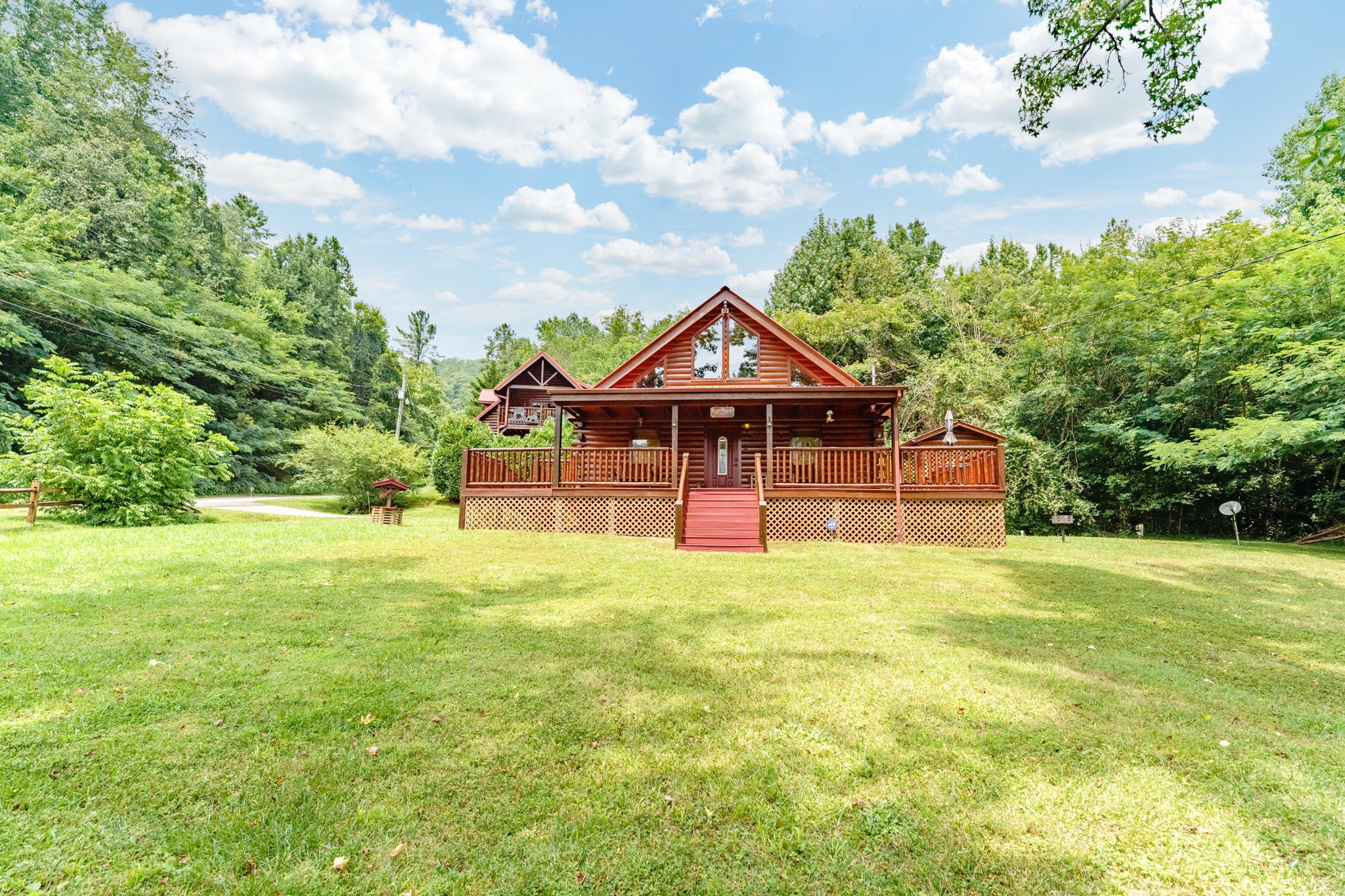 2740 Waldens Creek Road Sevierville, TN 37862 - Photo 1 of 40 a front view of a house with yard