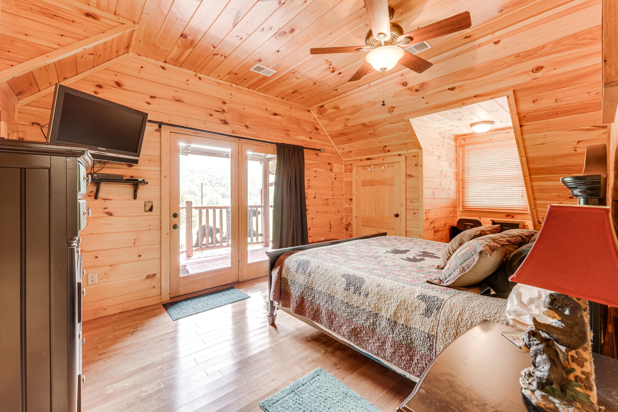 2740 Waldens Creek Road Sevierville, TN 37862 - Photo 14 of 40 a bedroom with a large bed and a large window