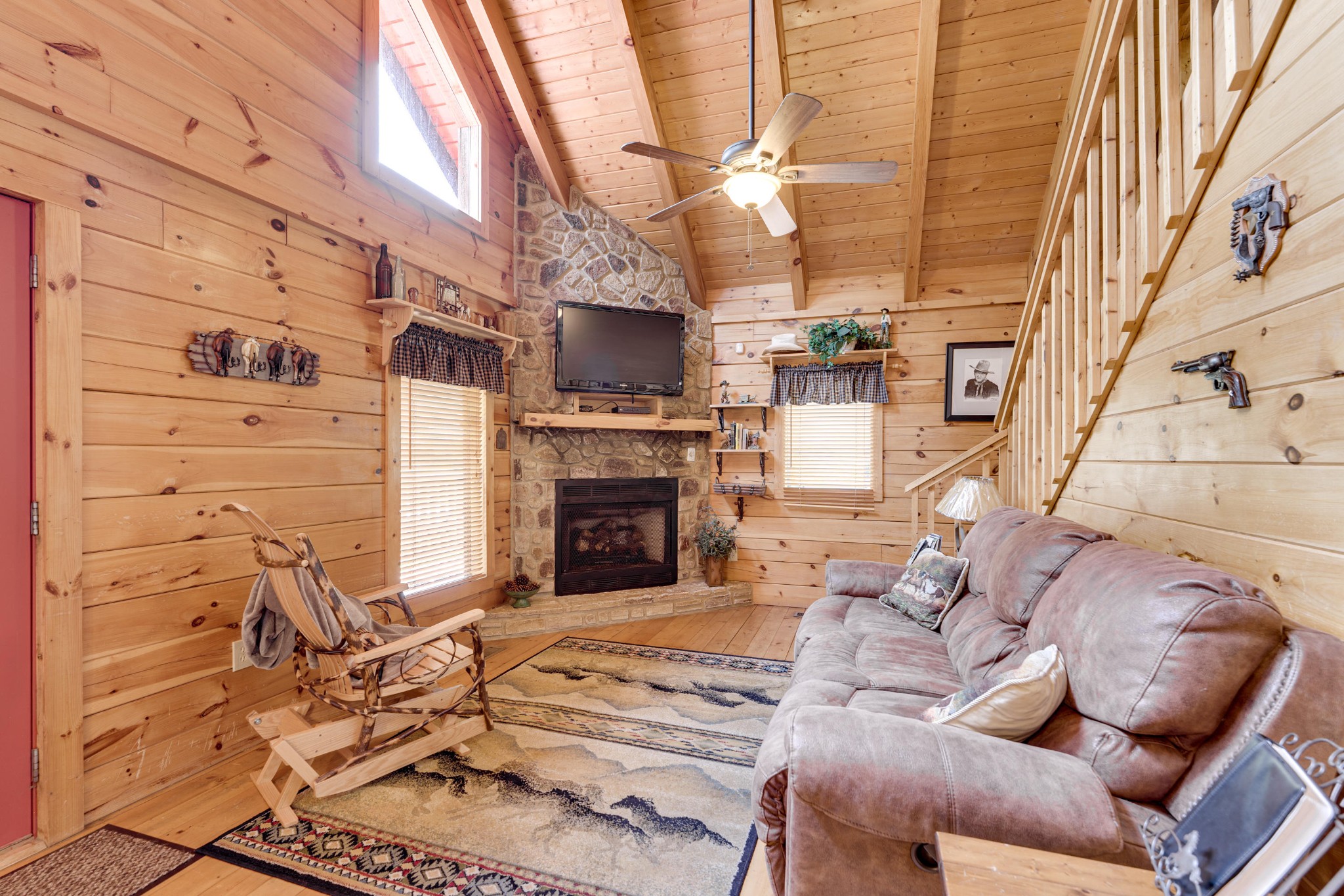 2740 Waldens Creek Road Sevierville, TN 37862 - Photo 16 of 40 a view of a livingroom with furniture and a fireplace