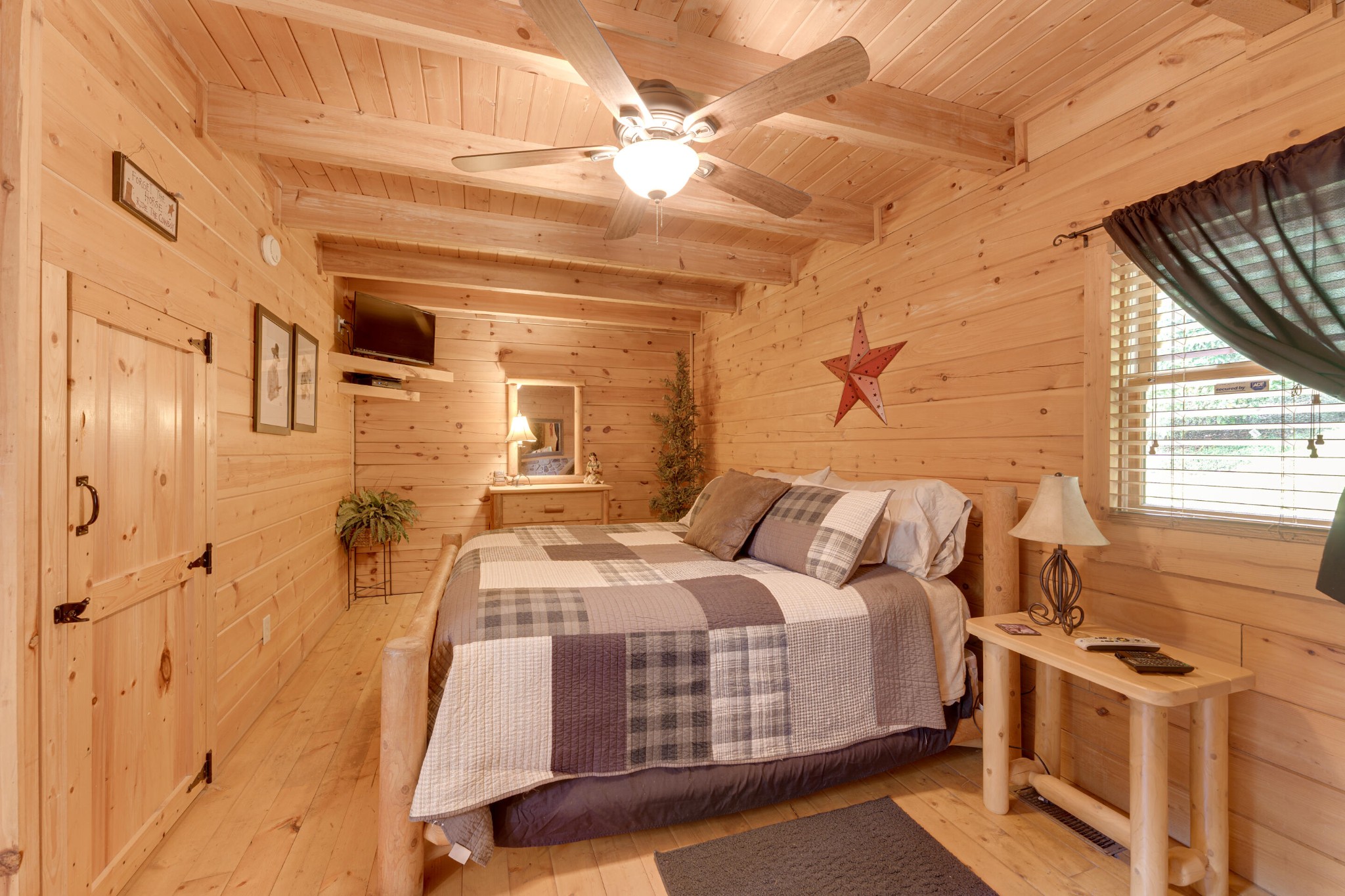 2740 Waldens Creek Road Sevierville, TN 37862 - Photo 22 of 40 a bedroom with a bed and a window