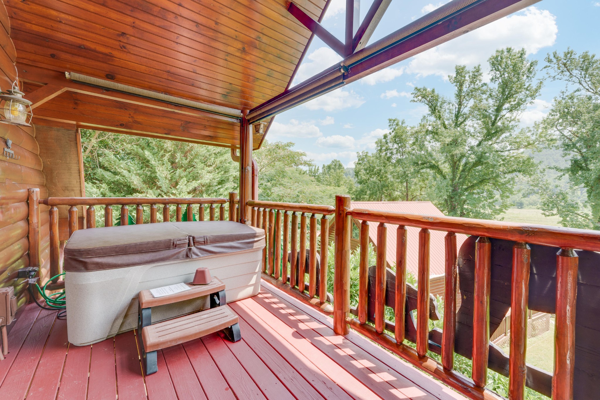 2740 Waldens Creek Road Sevierville, TN 37862 - Photo 29 of 40 a view of balcony with wooden floor and outdoor seating