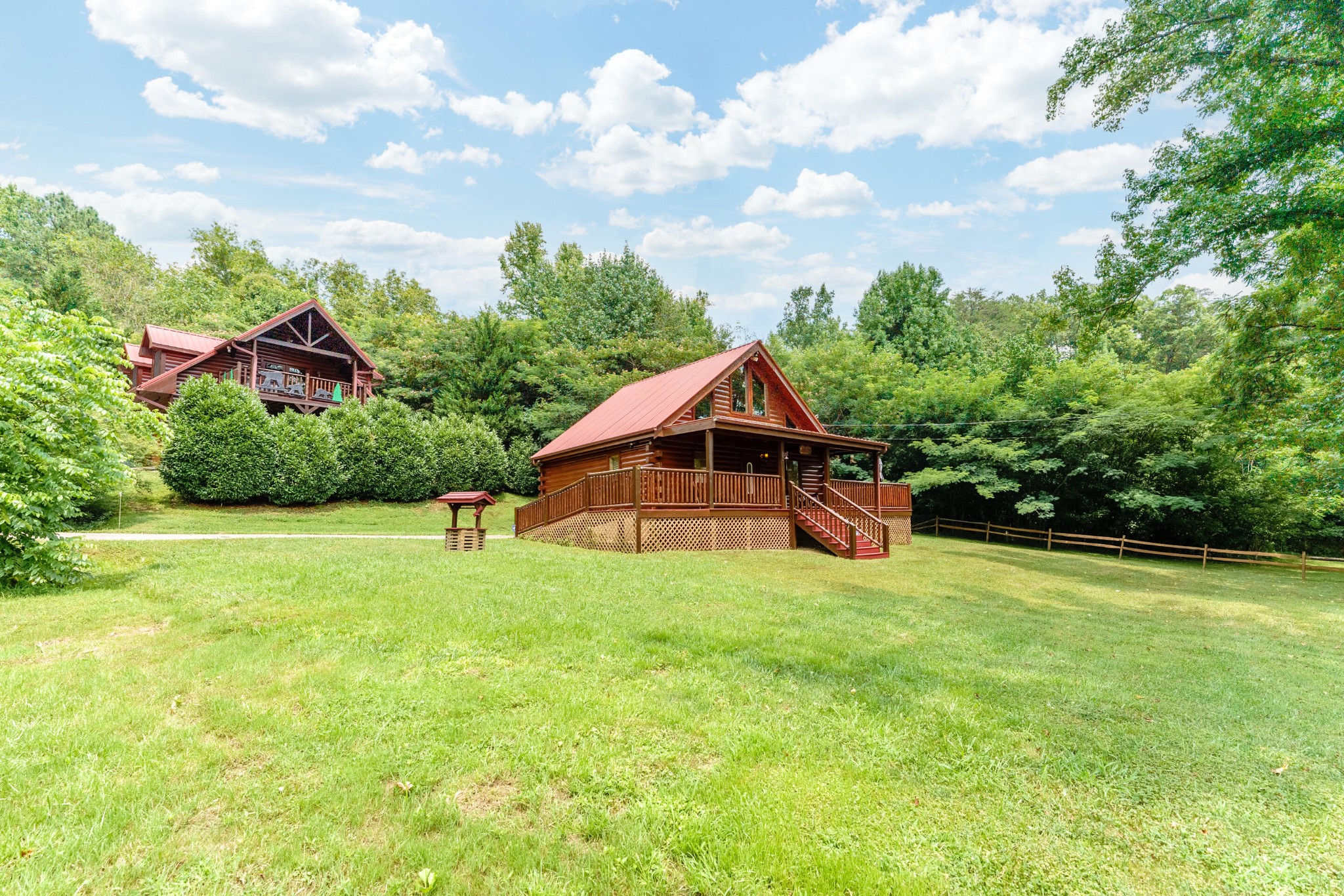 2740 Waldens Creek Road Sevierville, TN 37862 - Photo 33 of 40 a yellow and red house sitting in the middle of a field