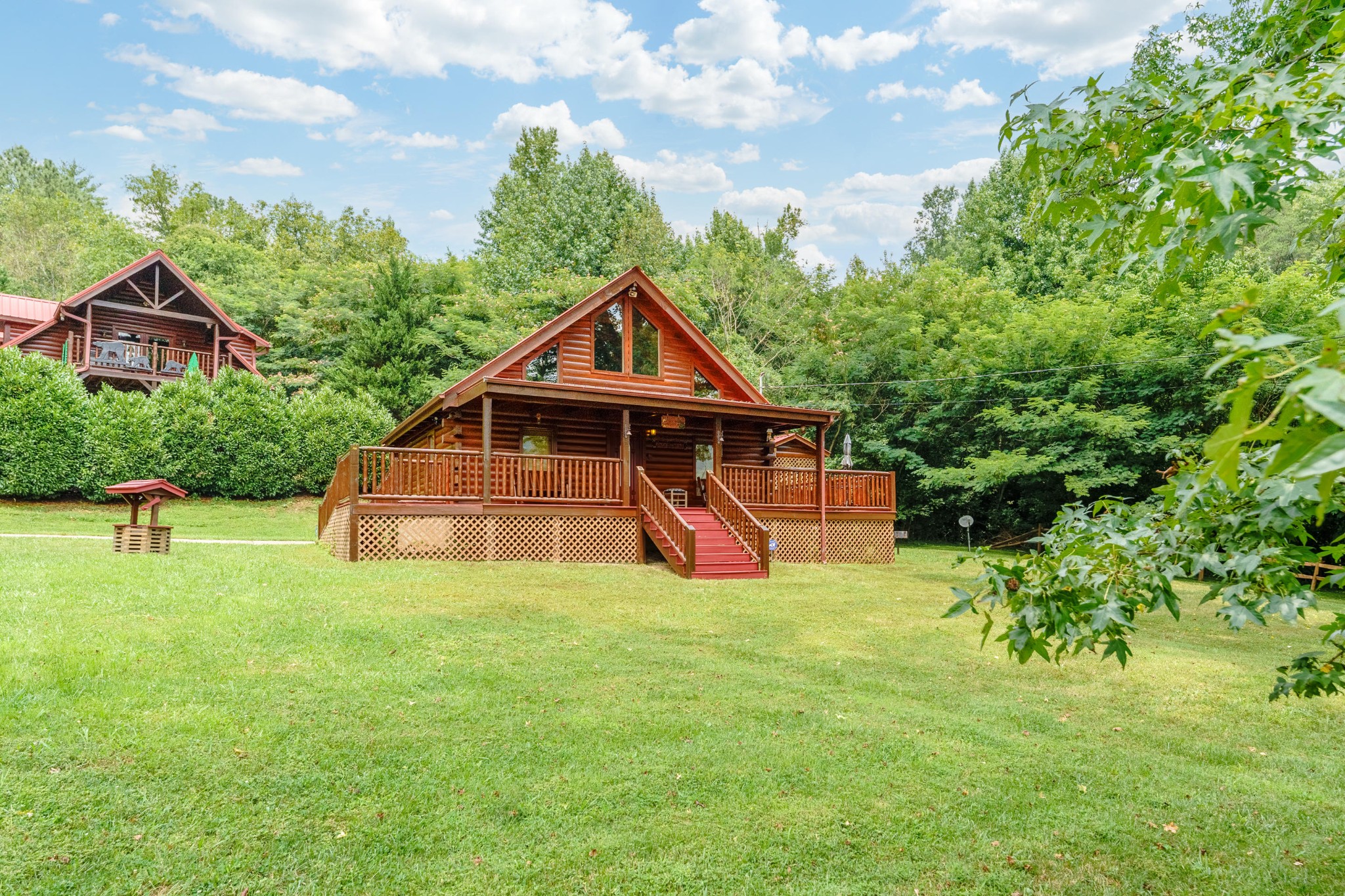 2740 Waldens Creek Road Sevierville, TN 37862 - Photo 35 of 40 a view of a house with a yard and sitting area