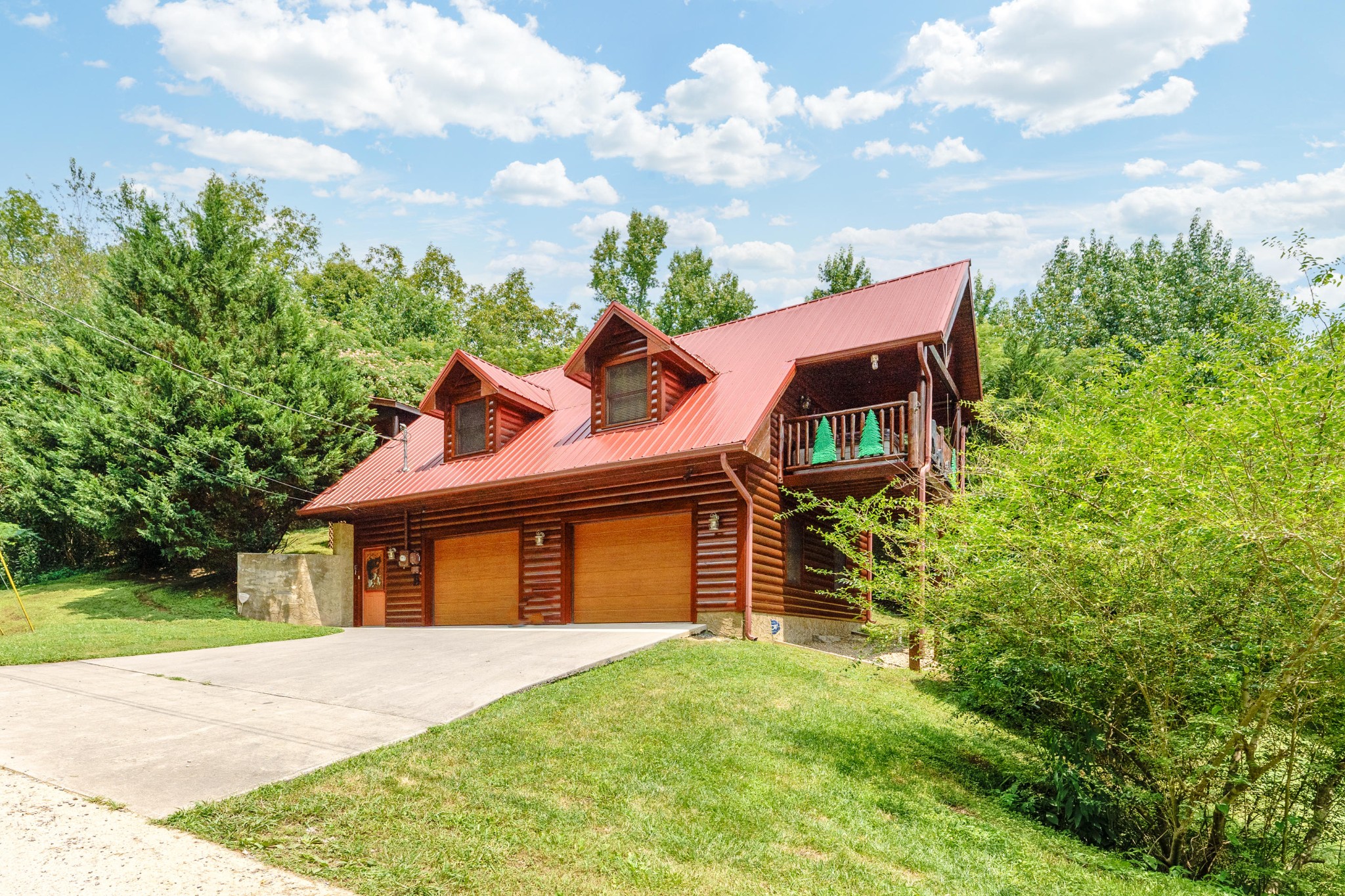 2740 Waldens Creek Road Sevierville, TN 37862 - Photo 37 of 40 a front view of a house with a garden