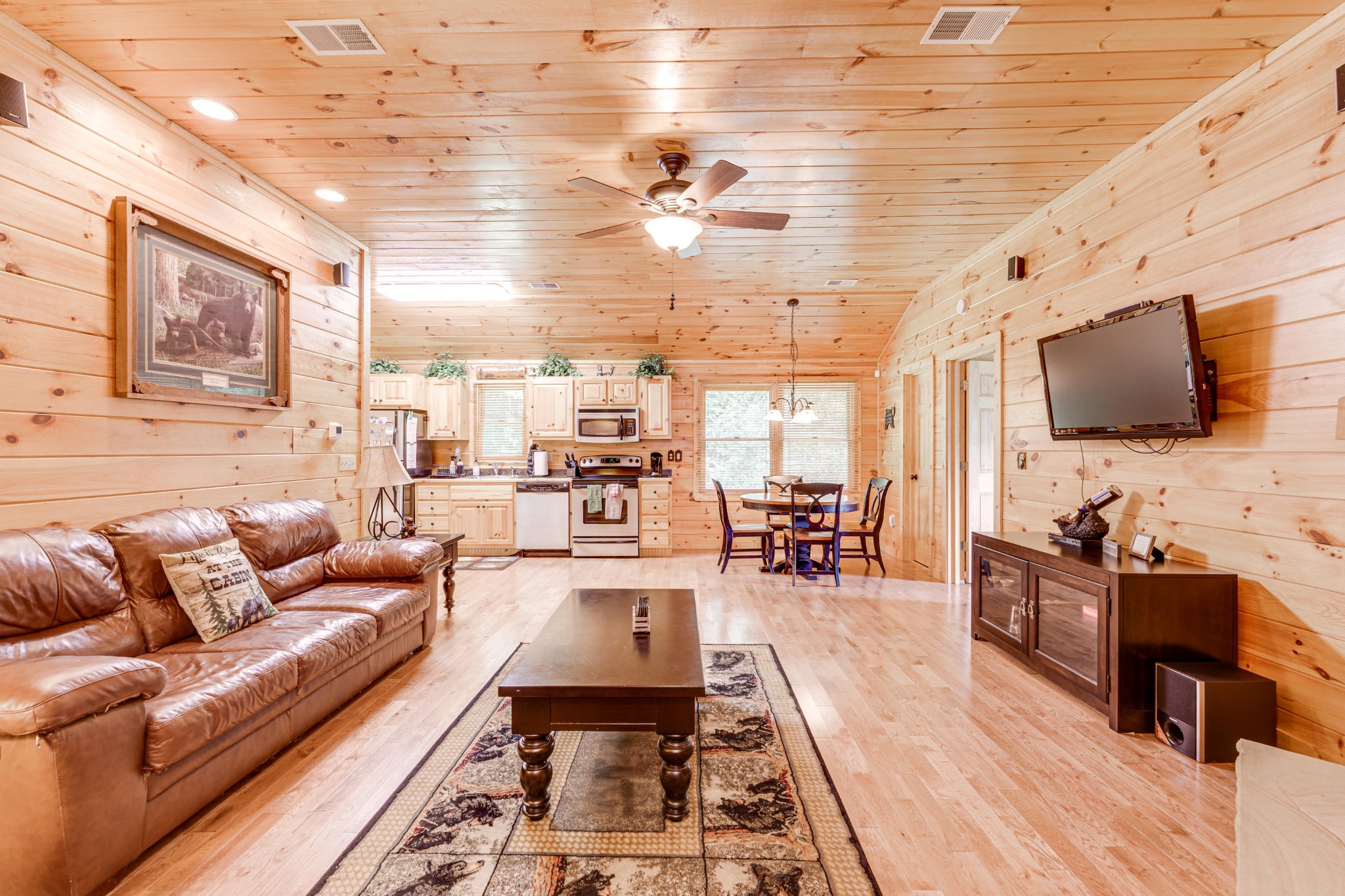 2740 Waldens Creek Road Sevierville, TN 37862 - Photo 4 of 40 a living room with furniture and a flat screen tv