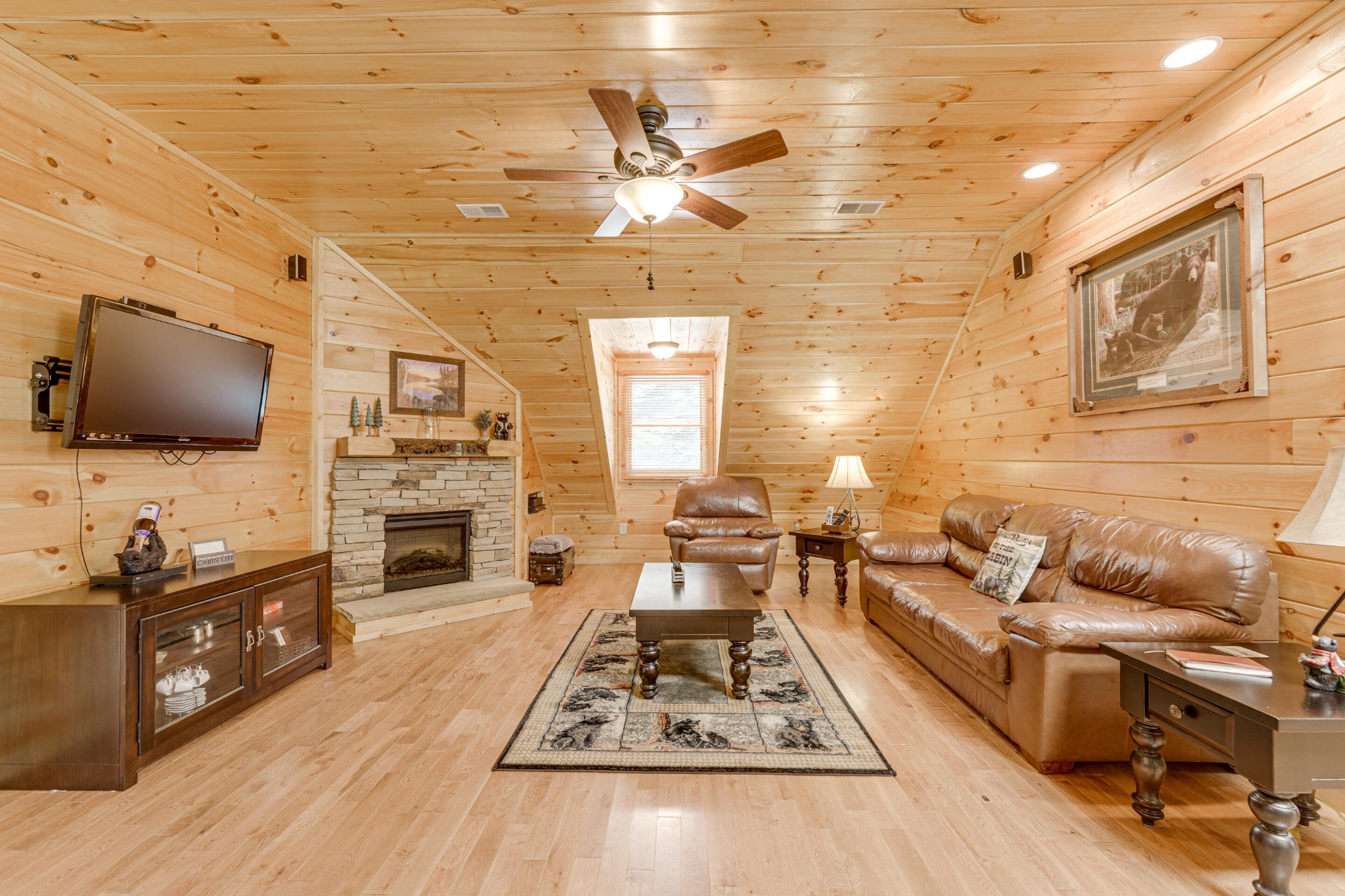 2740 Waldens Creek Road Sevierville, TN 37862 - Photo 5 of 40 a living room with furniture and a flat screen tv