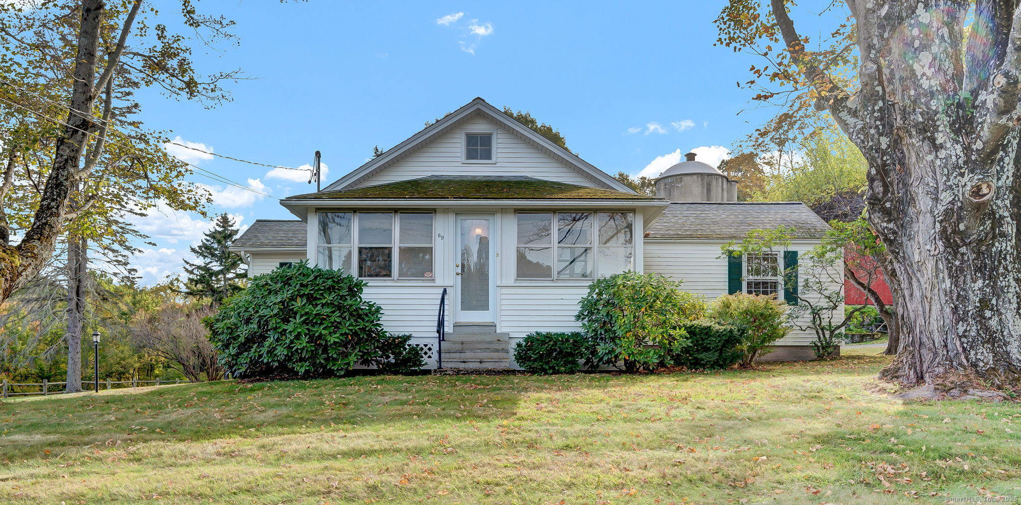 69 Westledge Road Simsbury, CT 06092 - Photo 1 of 1 a front view of a house with a garden