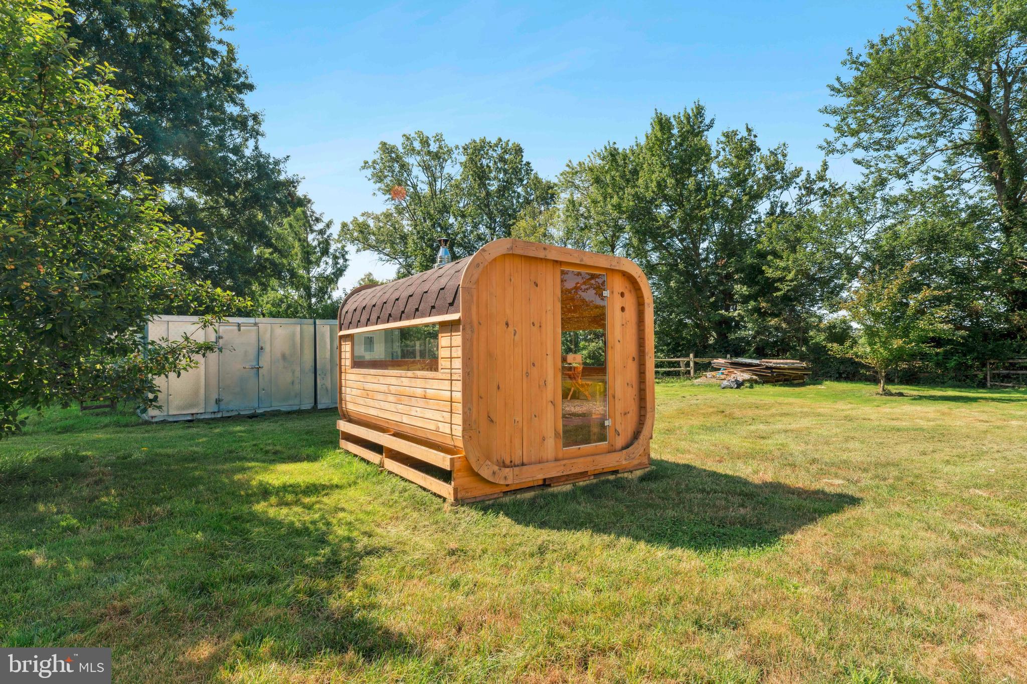 415 Geigel Hill Road Upper Black Eddy, PA 18972 - Photo 11 of 51 a view of backyard with small cabin and wooden fence