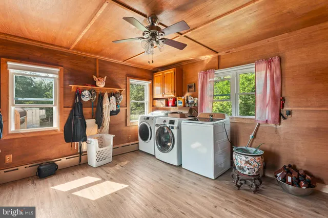 a kitchen with stainless steel appliances granite countertop sink stove top oven and cabinets