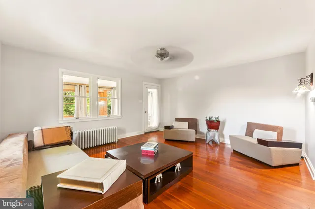 a spacious bedroom with a large bed and a large window