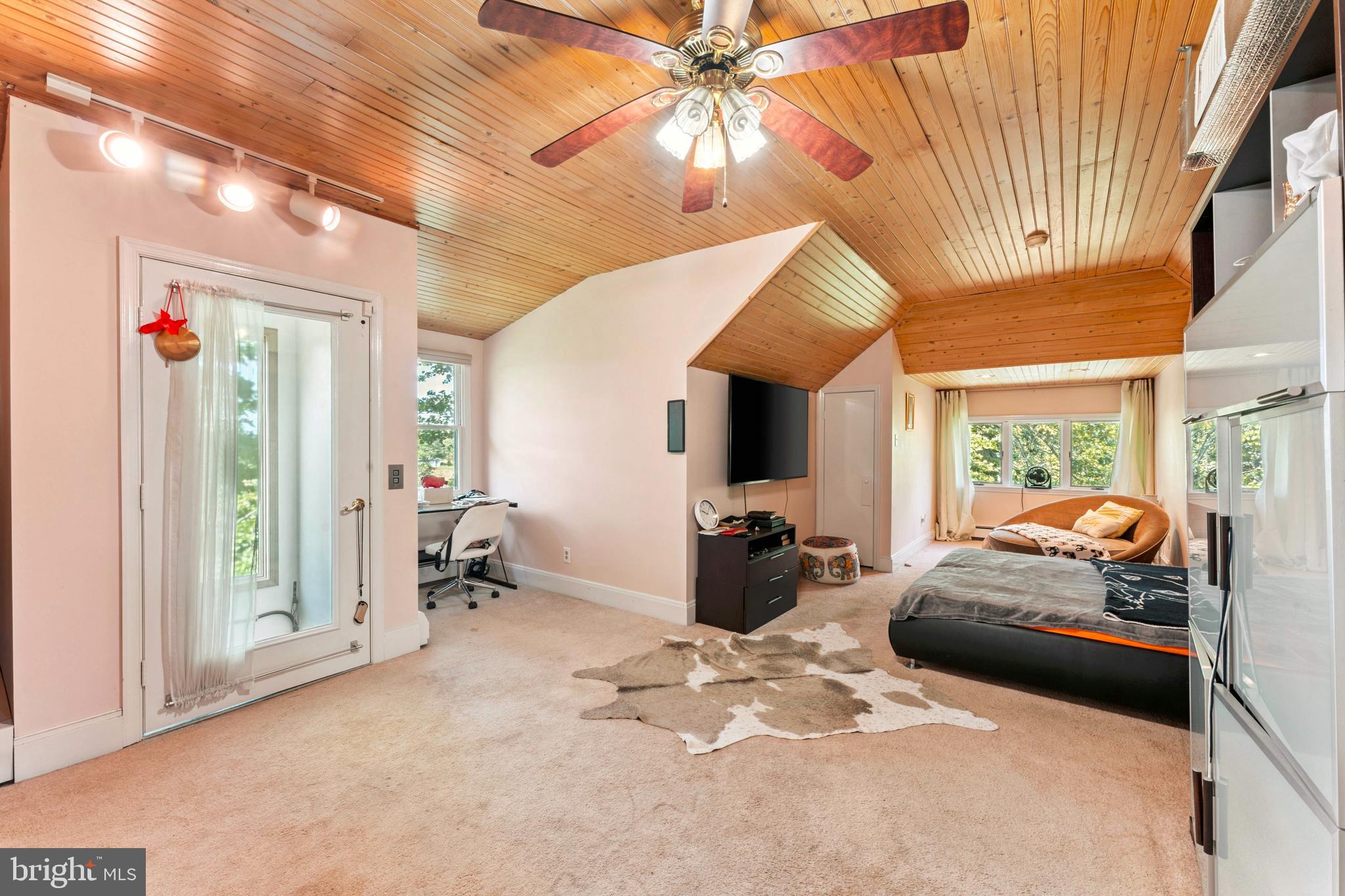 415 Geigel Hill Road Upper Black Eddy, PA 18972 - Photo 33 of 51 a bedroom with furniture and large windows