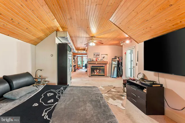 a spacious bathroom with a toilet sink and mirror