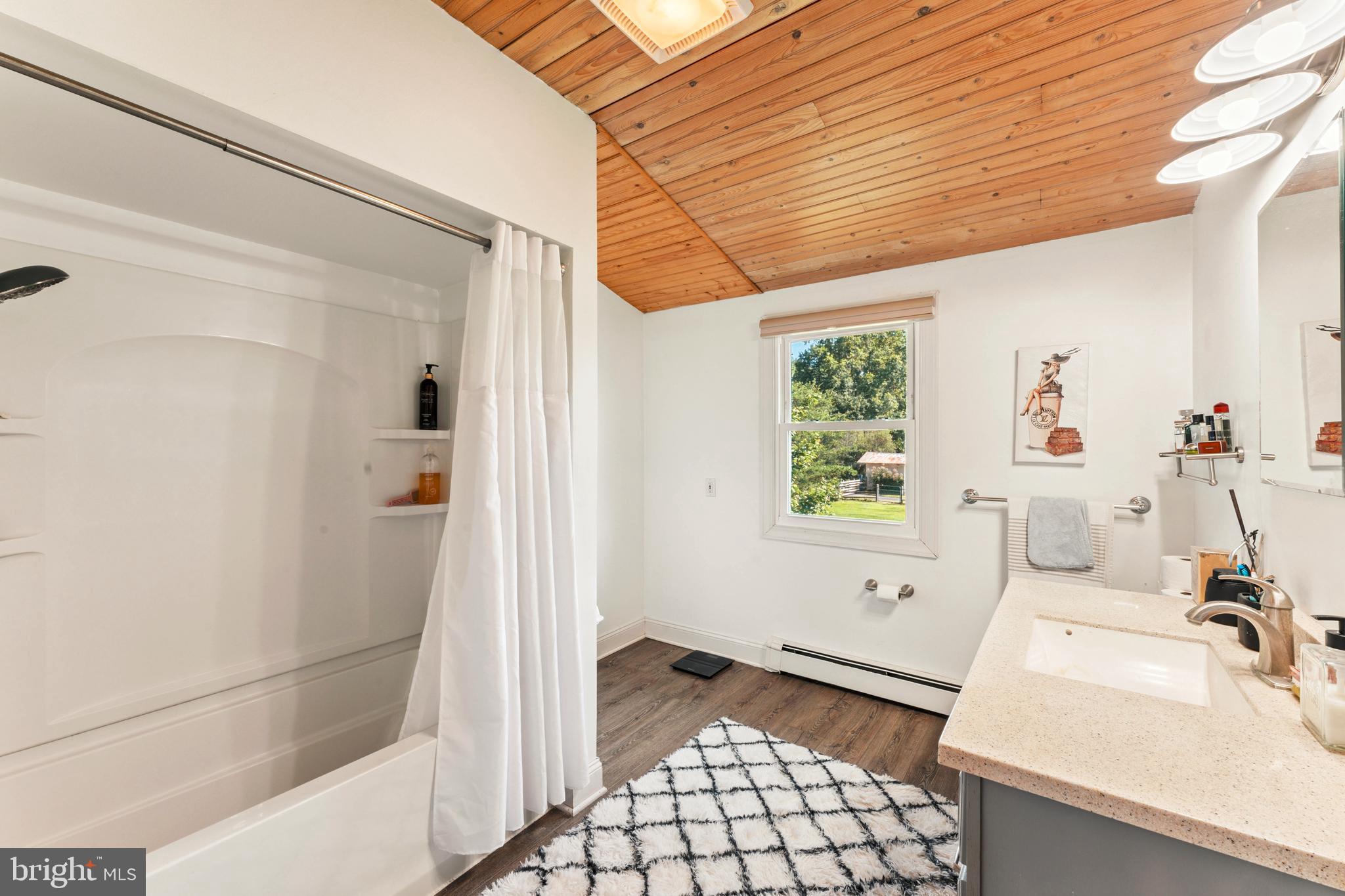 415 Geigel Hill Road Upper Black Eddy, PA 18972 - Photo 35 of 51 a bathroom with a sink a toilet and shower