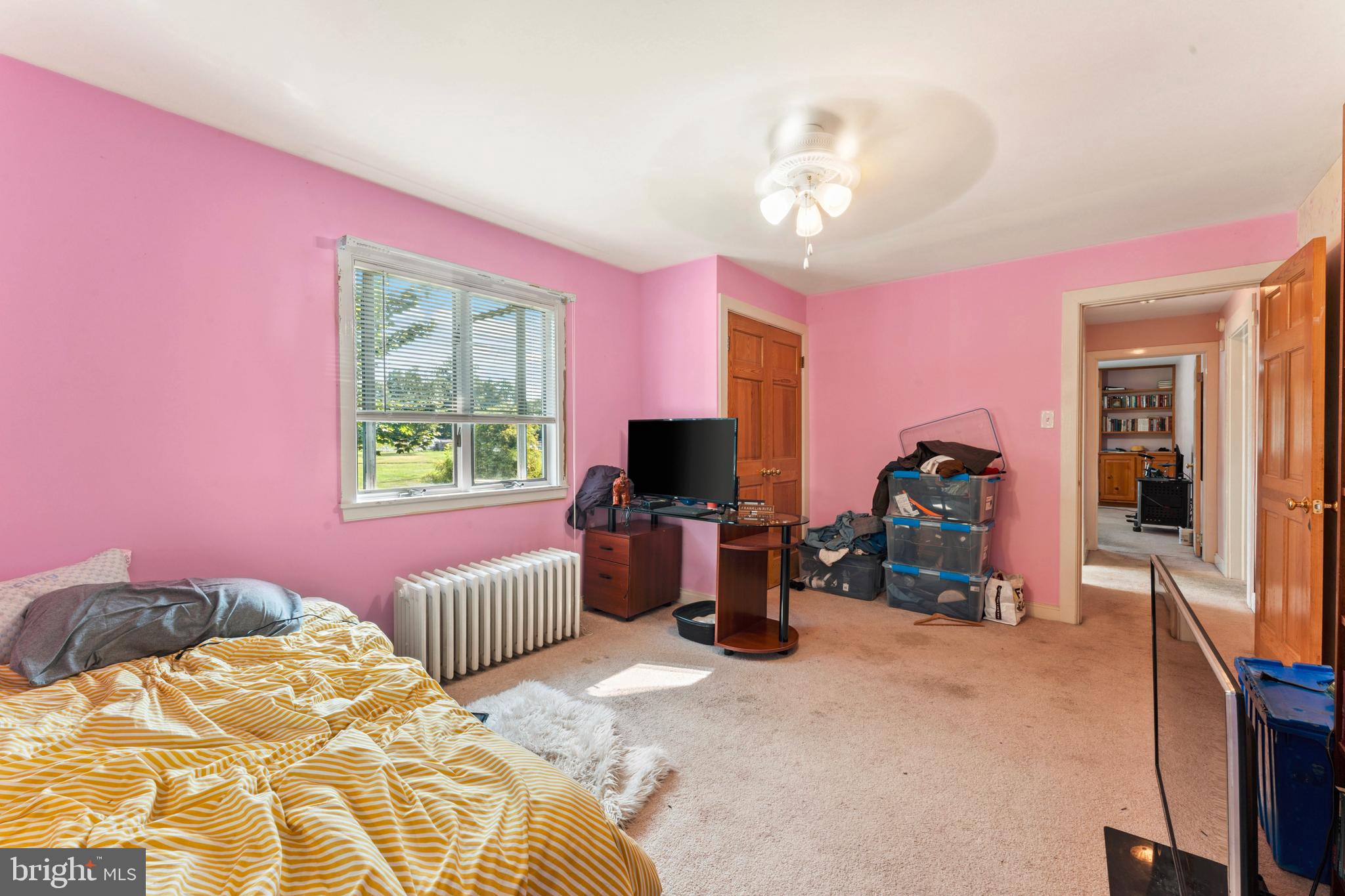 415 Geigel Hill Road Upper Black Eddy, PA 18972 - Photo 43 of 51 a bedroom with a bed and a chandelier
