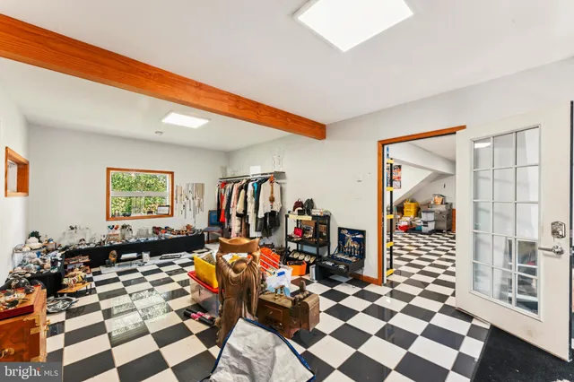 a room with furniture and white walls