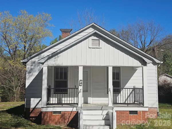 a front view of a house with garage