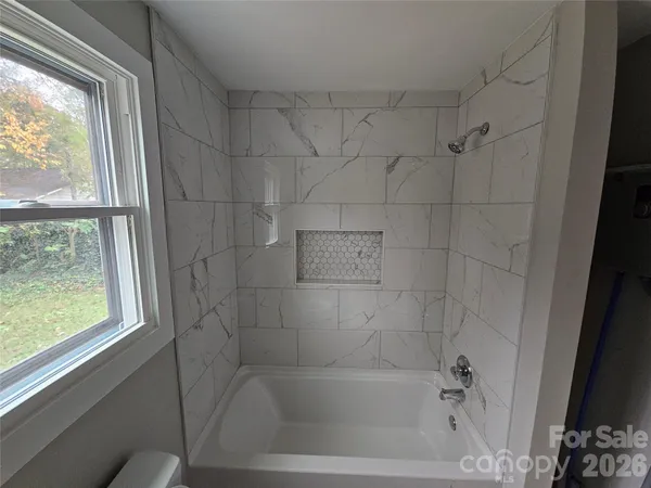 a close up of a bathtub curtain