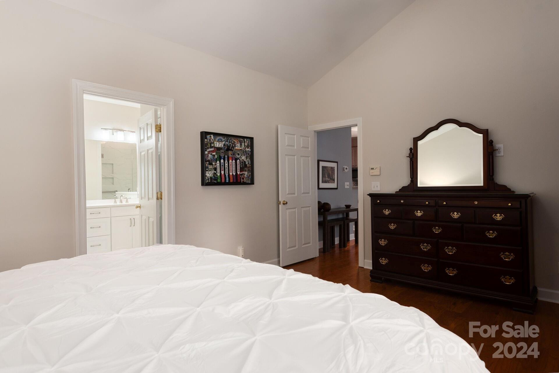 3322 Stettler View Road Charlotte, NC 28210 - Photo 13 of 27 a bedroom with a bed and a dresser