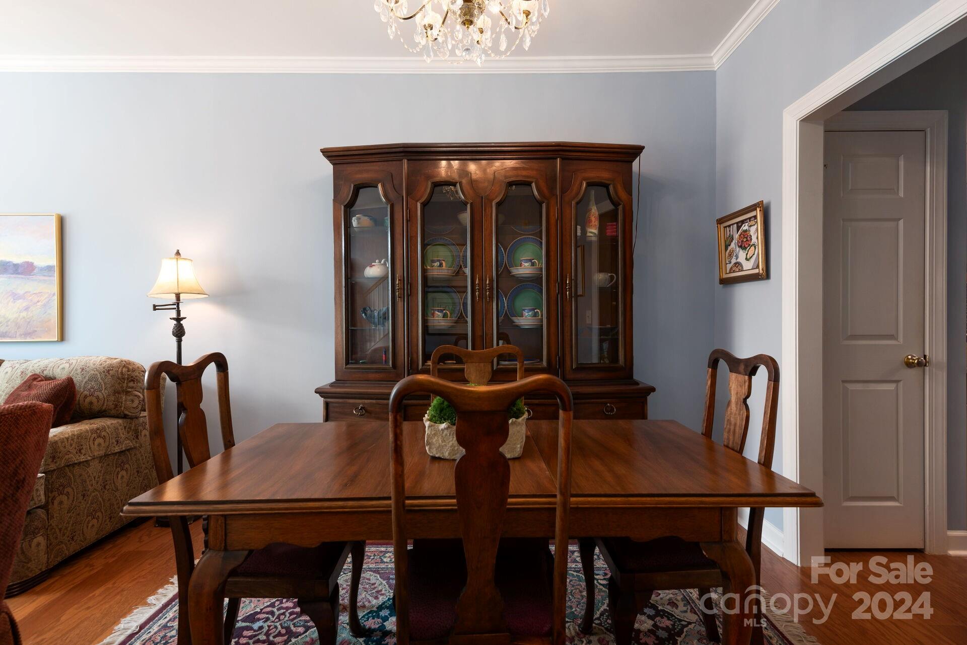 3322 Stettler View Road Charlotte, NC 28210 - Photo 5 of 27 a view of a dining room with furniture and chandelier