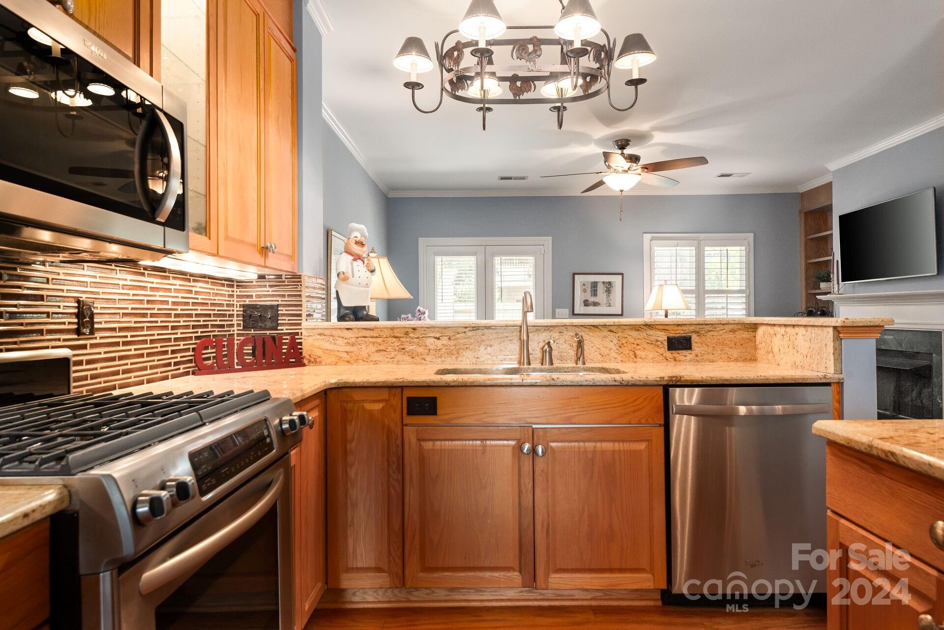 3322 Stettler View Road Charlotte, NC 28210 - Photo 6 of 27 a open kitchen with a stove and a microwave