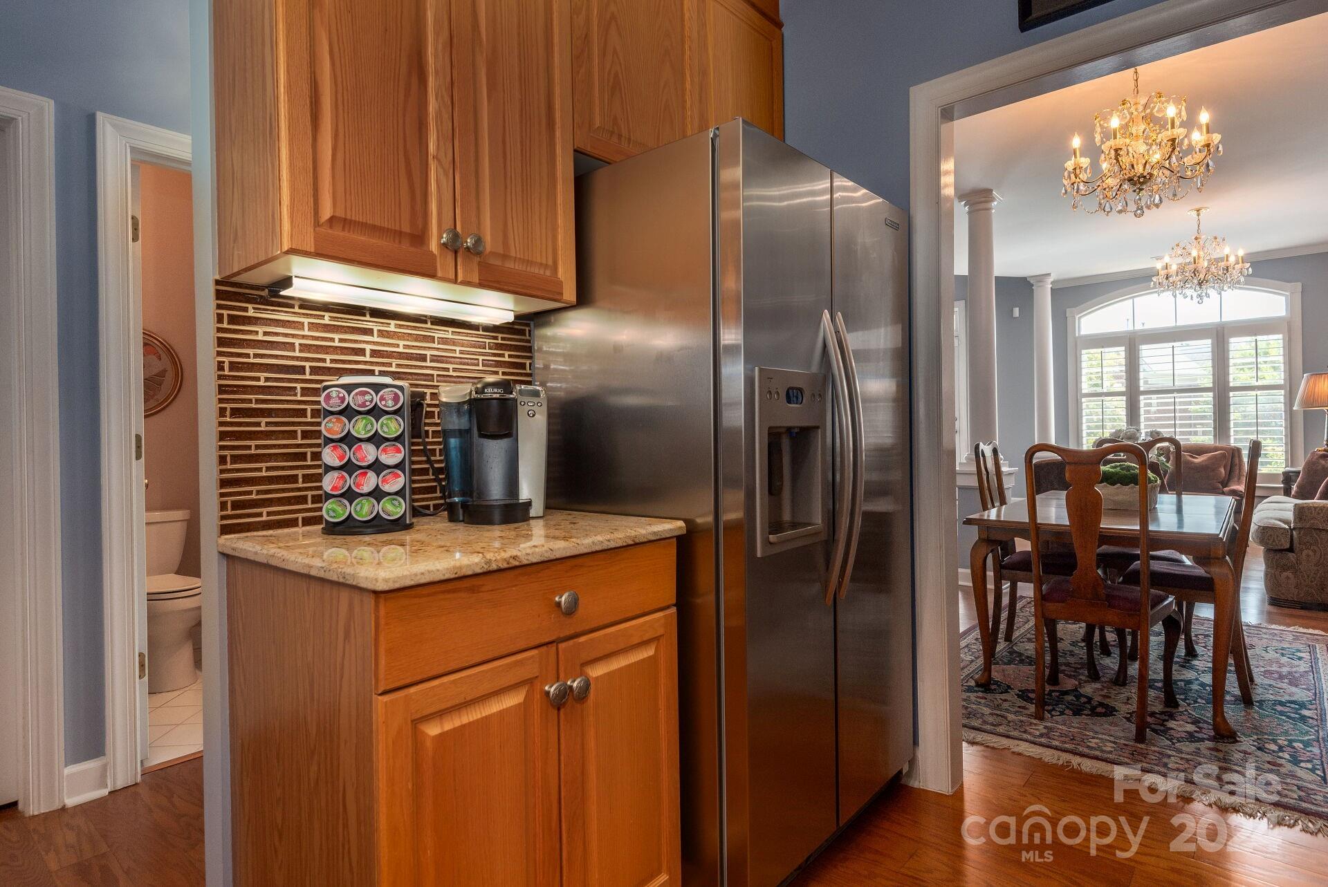 3322 Stettler View Road Charlotte, NC 28210 - Photo 8 of 27 a kitchen with stainless steel appliances granite countertop a refrigerator and a stove