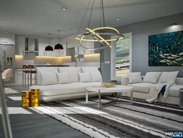 a living room with furniture and a chandelier