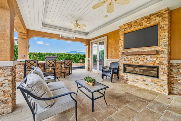 a living room with fireplace furniture and a flat screen tv