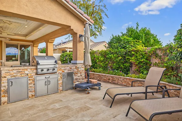 a view of a chairs and table in a patio