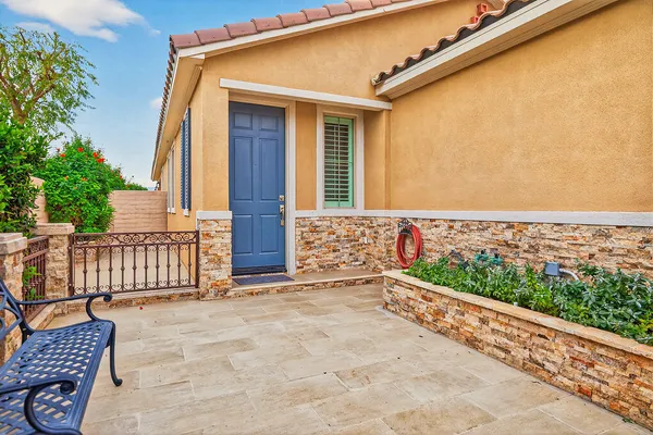 a view of a porch with wooden floor and fence