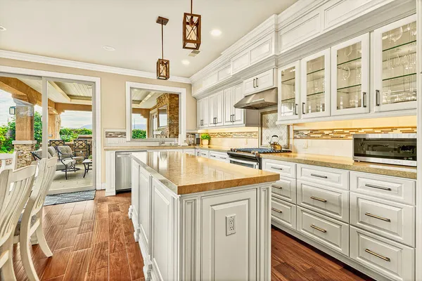 a kitchen with a sink stove and cabinets
