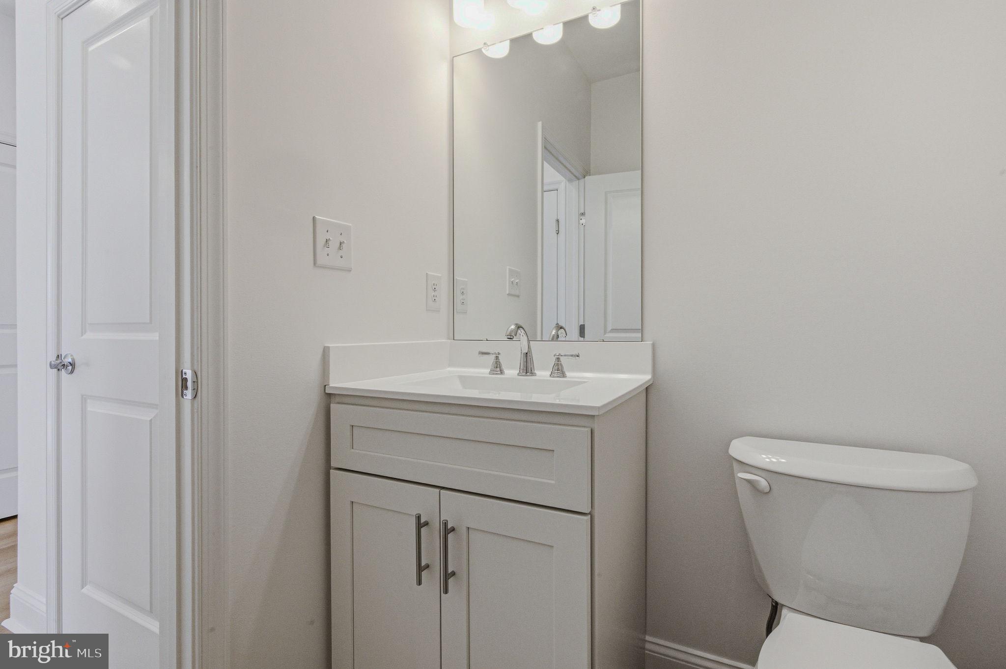 2503 A Duncan Road Wilmington, DE 19808 - Photo 11 of 41 a bathroom with a toilet sink and mirror