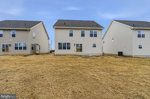 a front view of a house with large windows
