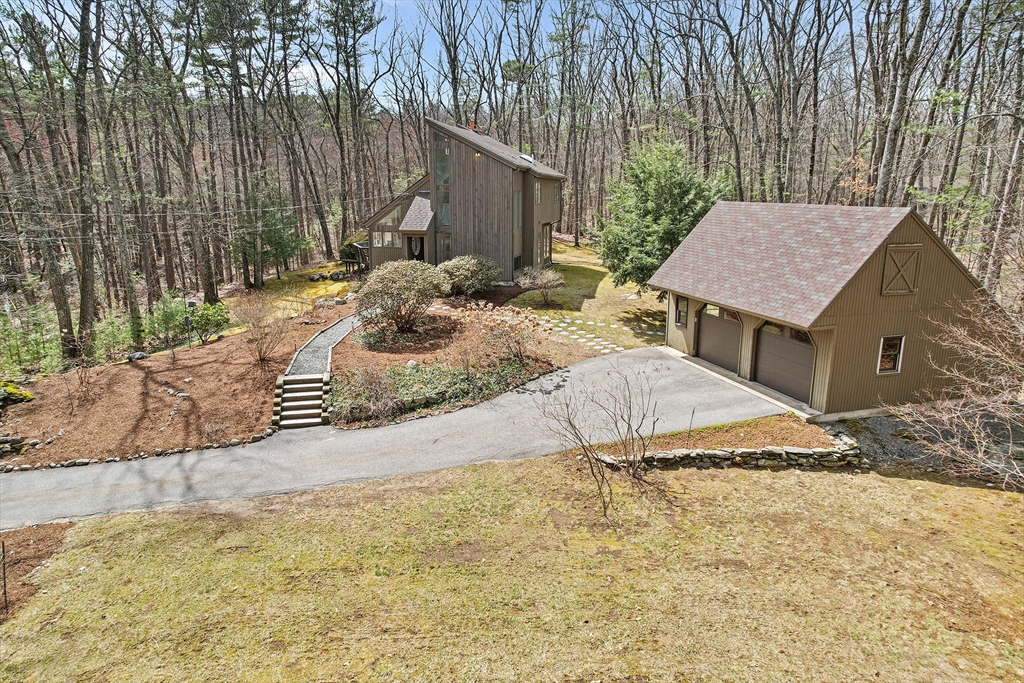 222 Davidson Road Boxborough, MA 01719 - Photo 4 of 16 a view of house with backyard and trees
