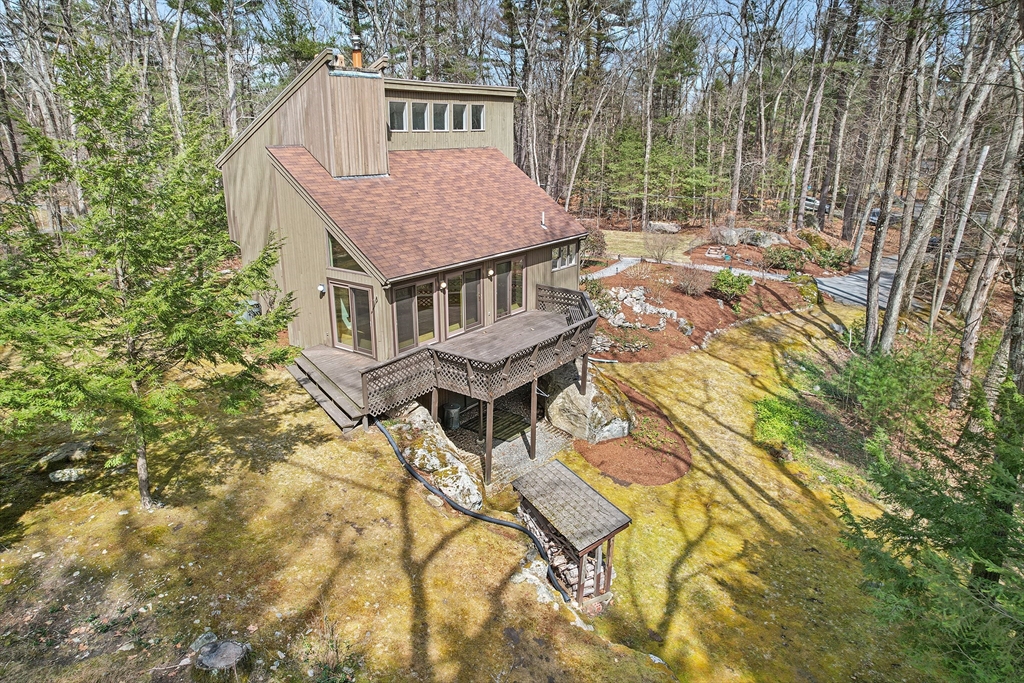 222 Davidson Road Boxborough, MA 01719 - Photo 7 of 16 an aerial view of residential house with pool and trees all around