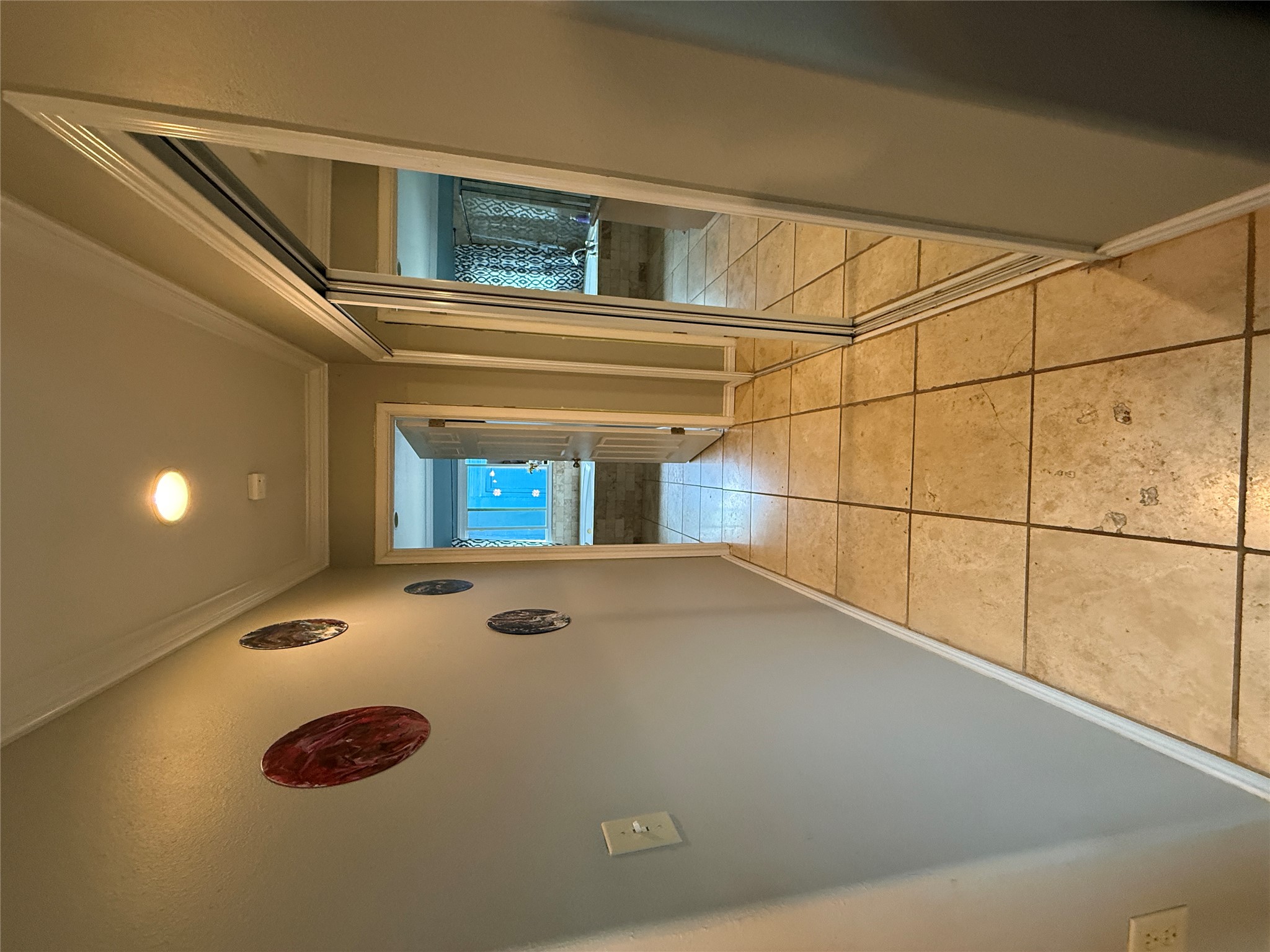 7501 West Gate Boulevard Austin, TX 78745 - Photo 11 of 33 Corridor with crown molding and light tile patterned floors