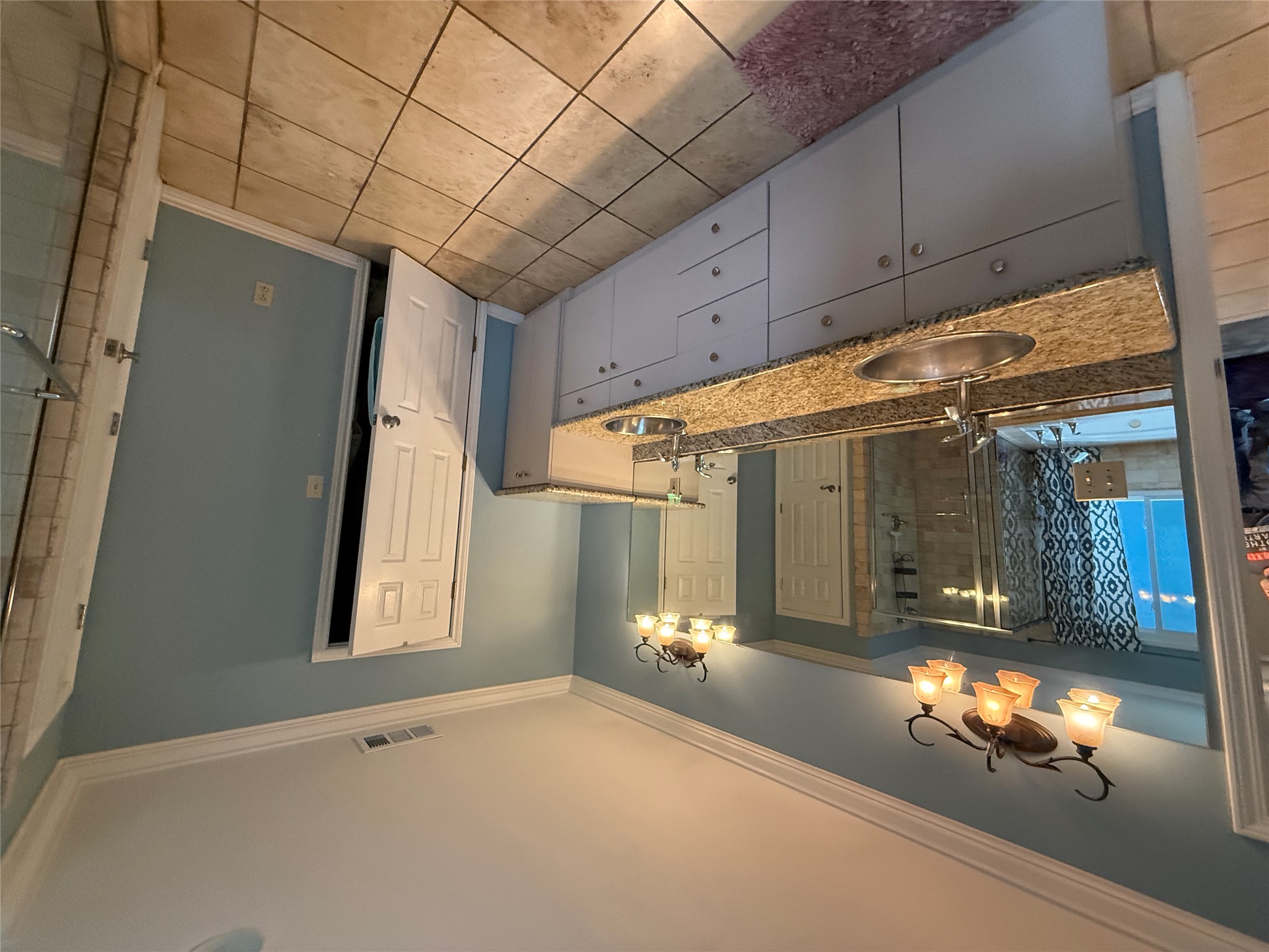 7501 West Gate Boulevard Austin, TX 78745 - Photo 13 of 33 Bathroom with a stall shower, a bath, double vanity, ornamental molding, and light tile patterned floors