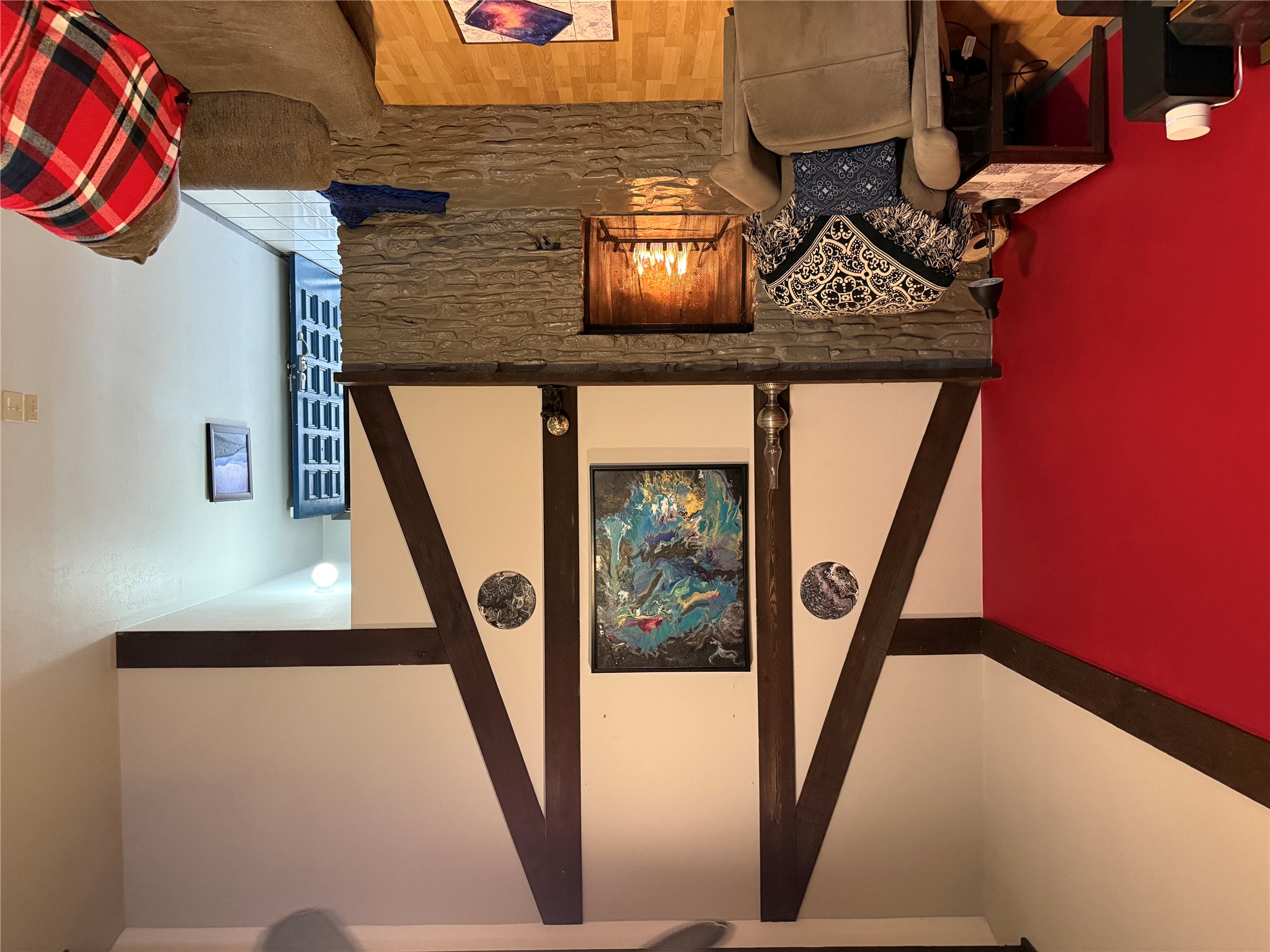7501 West Gate Boulevard Austin, TX 78745 - Photo 22 of 33 Living area with a stone fireplace and wood finished floors