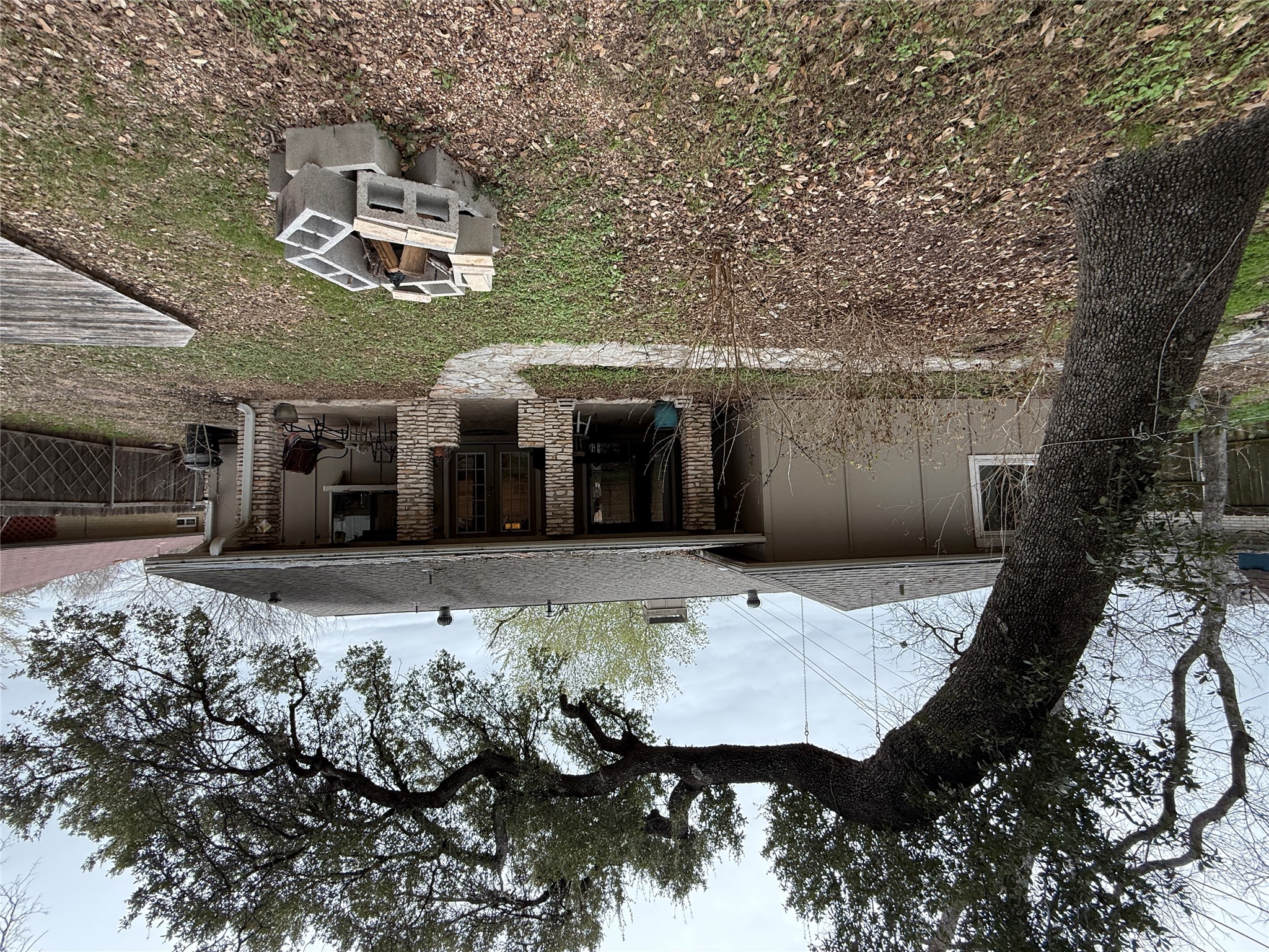 7501 West Gate Boulevard Austin, TX 78745 - Photo 26 of 33 Rear view of property featuring a patio, a chimney, an outdoor fire pit, and roof with shingles