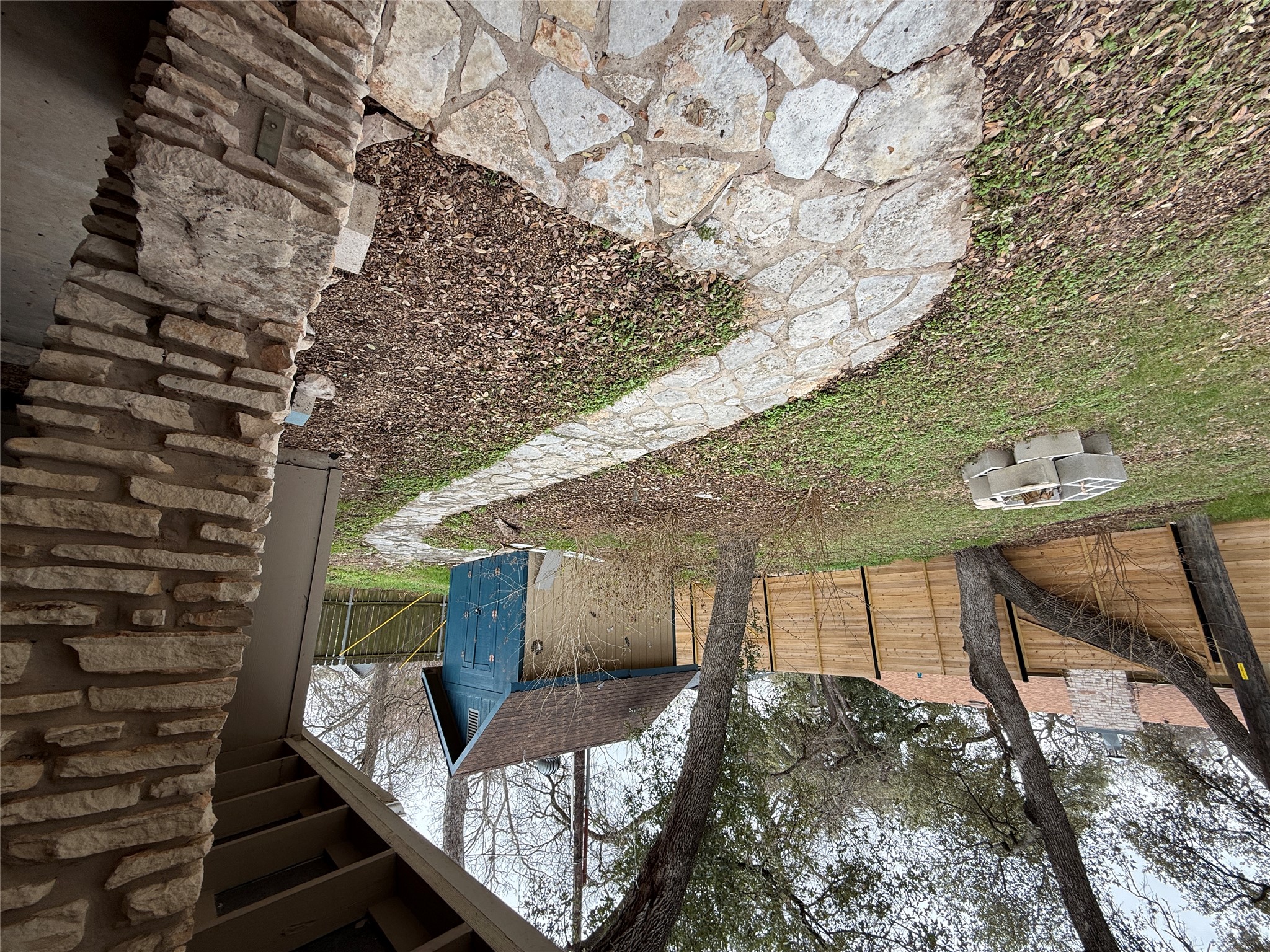 7501 West Gate Boulevard Austin, TX 78745 - Photo 29 of 33 Fenced backyard featuring a storage shed and a fire pit