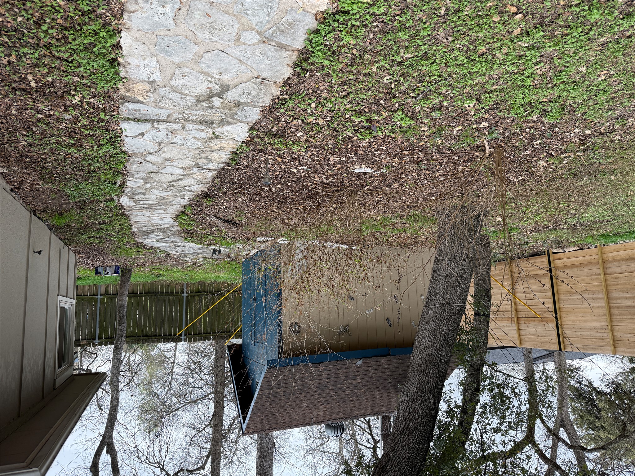 7501 West Gate Boulevard Austin, TX 78745 - Photo 30 of 33 Fenced backyard with a storage shed