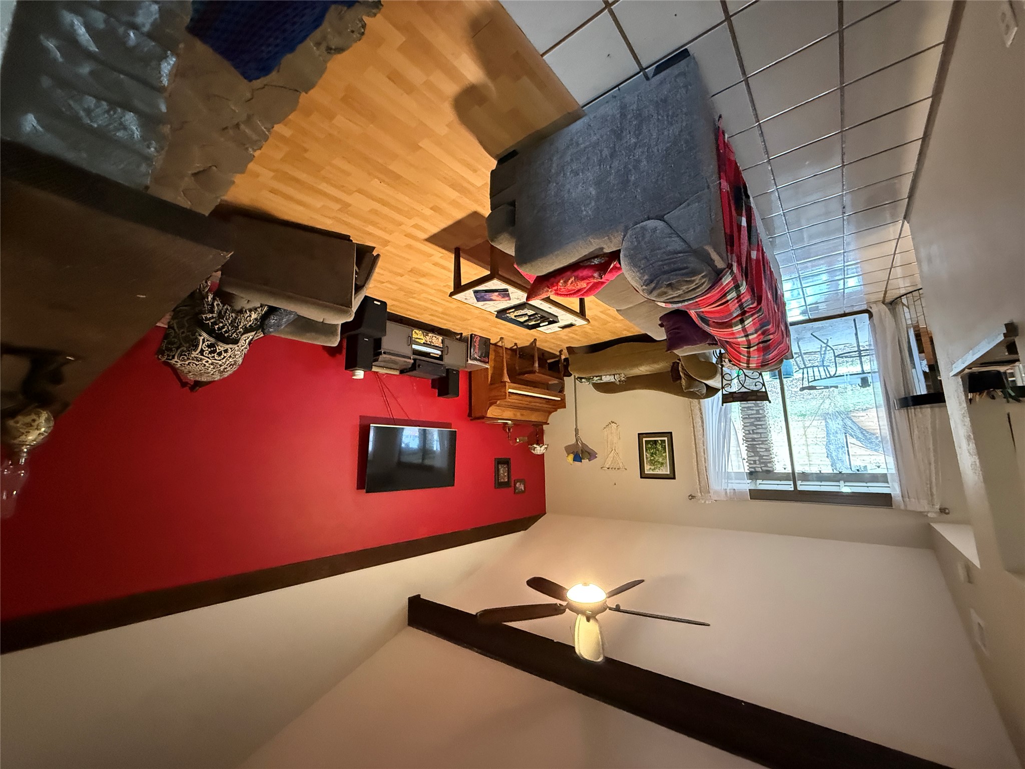 7501 West Gate Boulevard Austin, TX 78745 - Photo 4 of 33 Living room with lofted ceiling, a ceiling fan, and light wood-style flooring