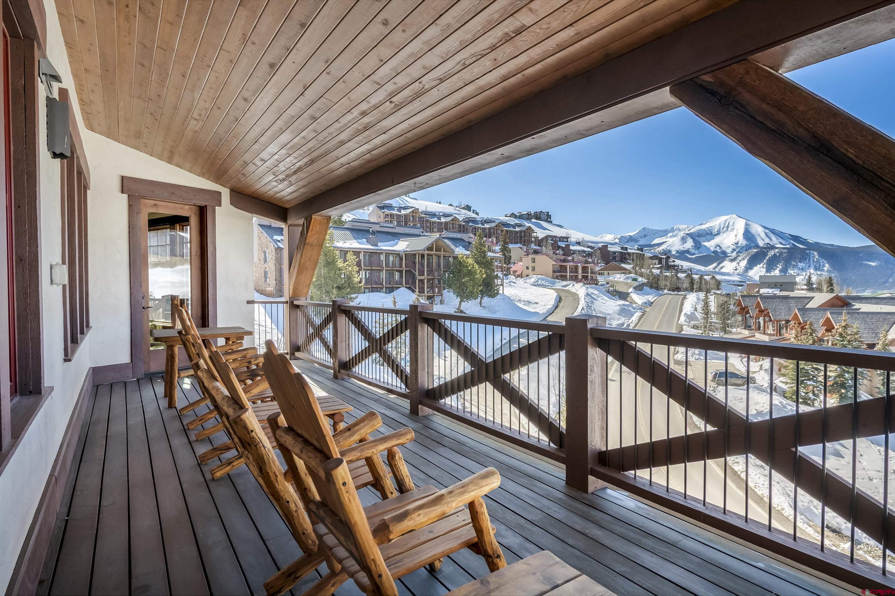 14 Hunter Hill Road, Unit C302 Crested Butte, CO 81225 - Photo 14 of 32 a view of a balcony with furniture and wooden floor