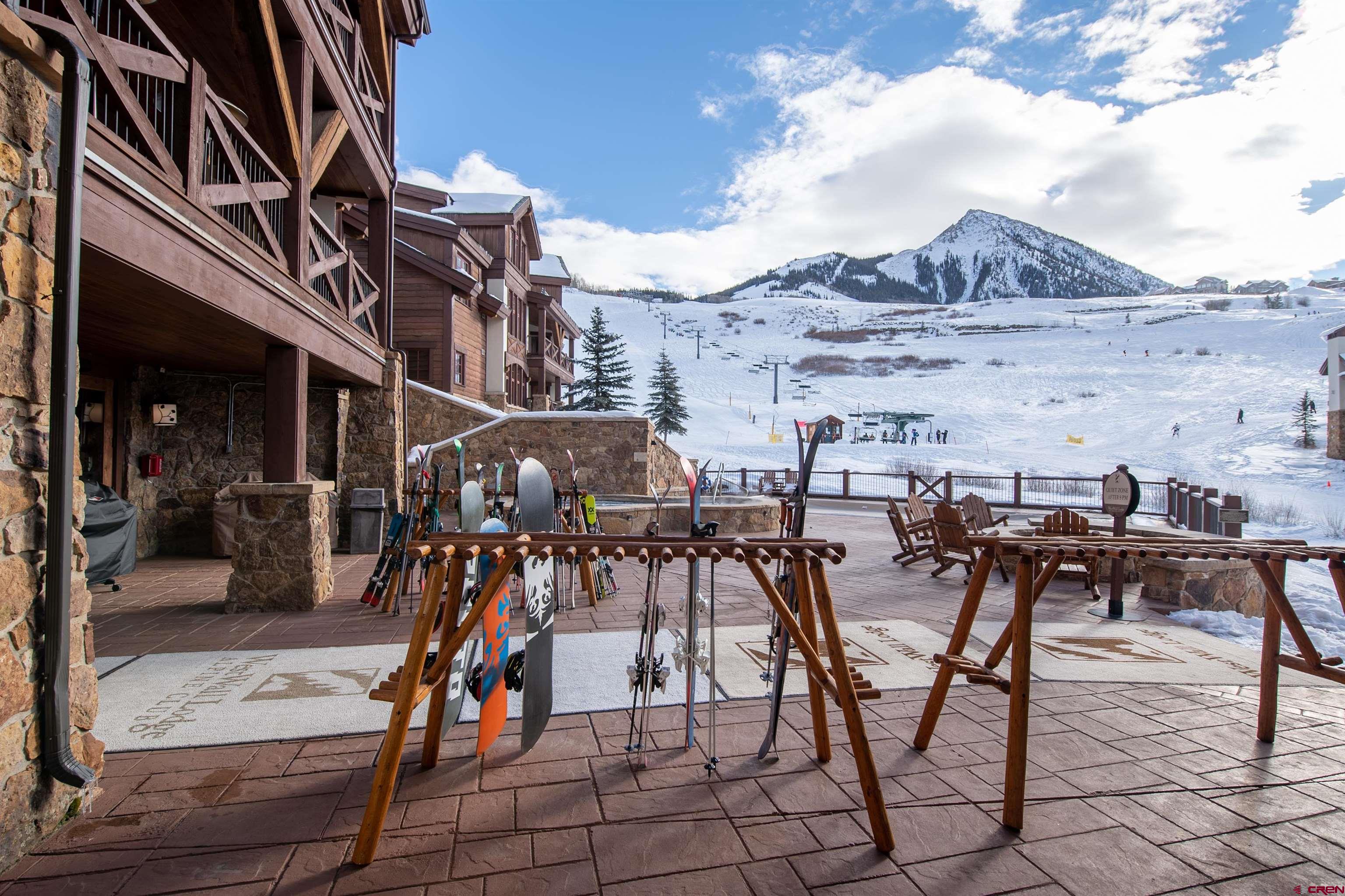 14 Hunter Hill Road, Unit C302 Crested Butte, CO 81225 - Photo 26 of 32 a view of a dinning tables and chairs in a patio