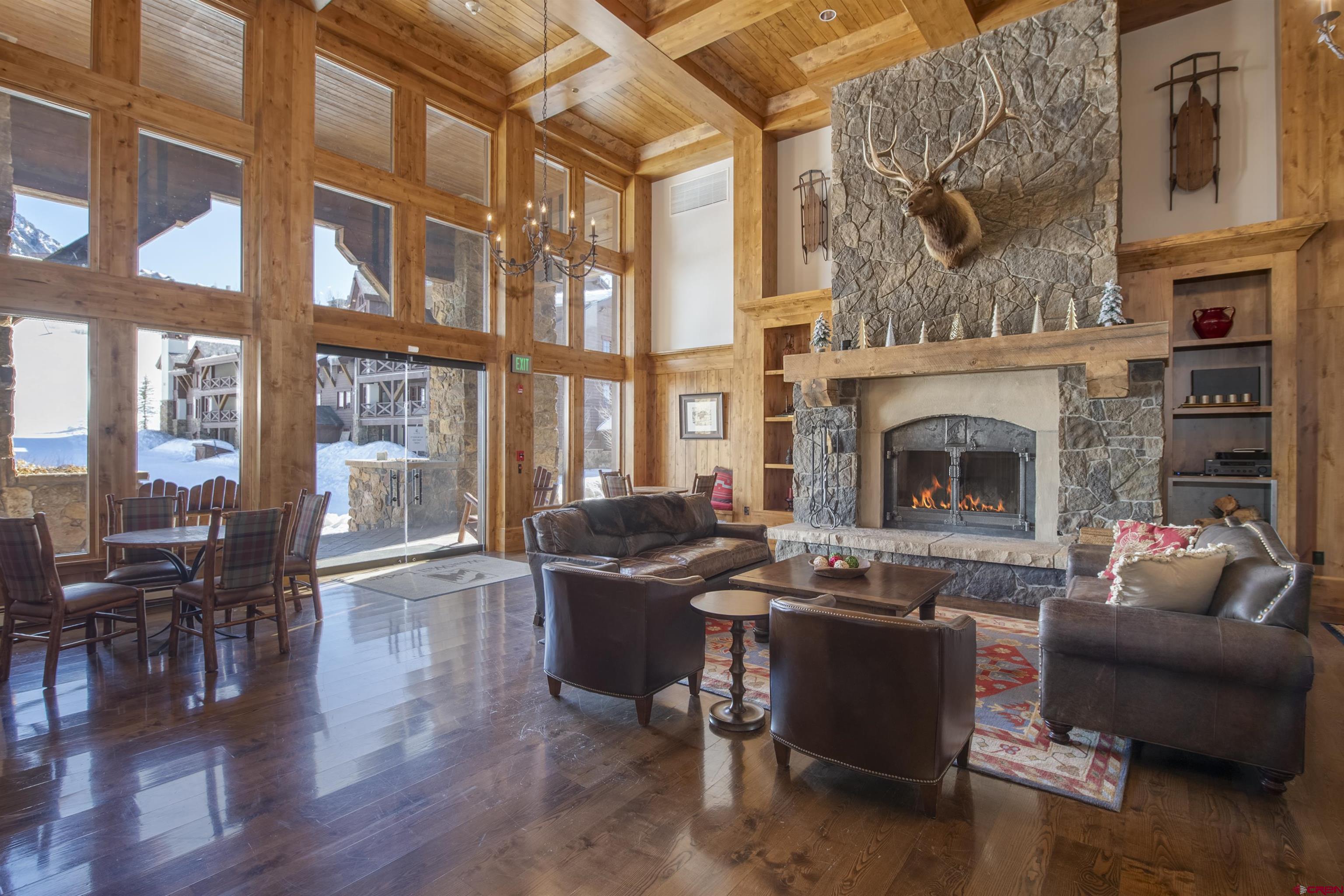 14 Hunter Hill Road, Unit C302 Crested Butte, CO 81225 - Photo 27 of 32 a living room with furniture a fireplace and wooden floor